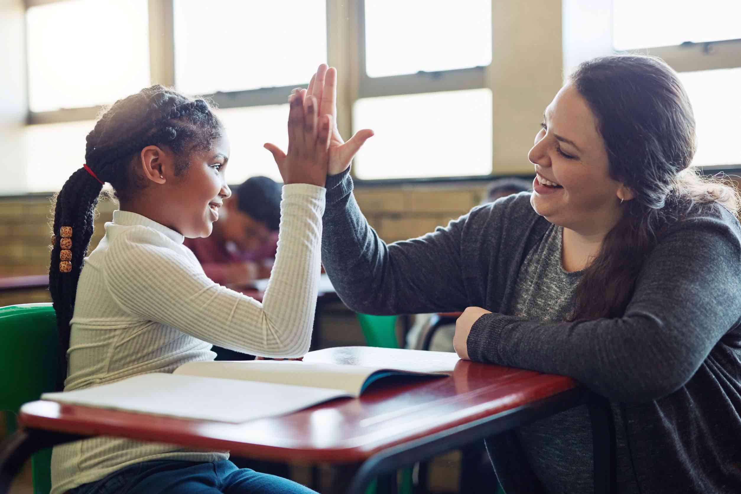 Teacher and student in a classroom